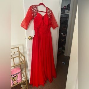 Long beautiful red dress for prom or special event. NEVER WORN. Tags attached.
